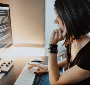 Woman is coding on a computer